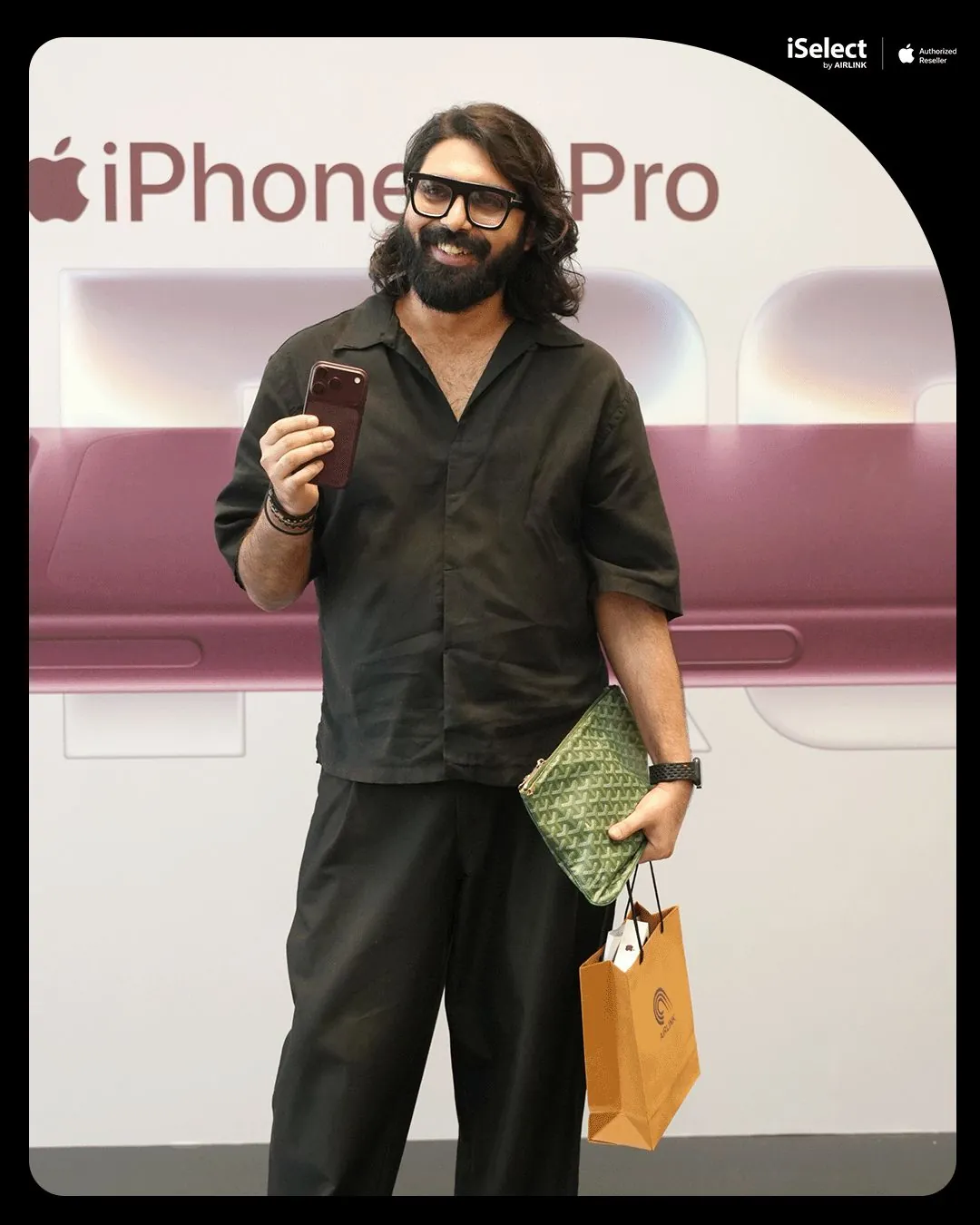 First buyer with his new iPhone 18 Pro at the iSelect by Airlink photo wall
