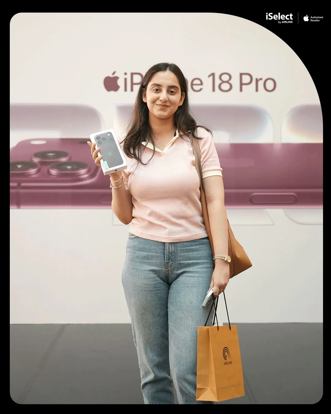 First buyer with her new iPhone 18 Pro at the iSelect by Airlink photo wall